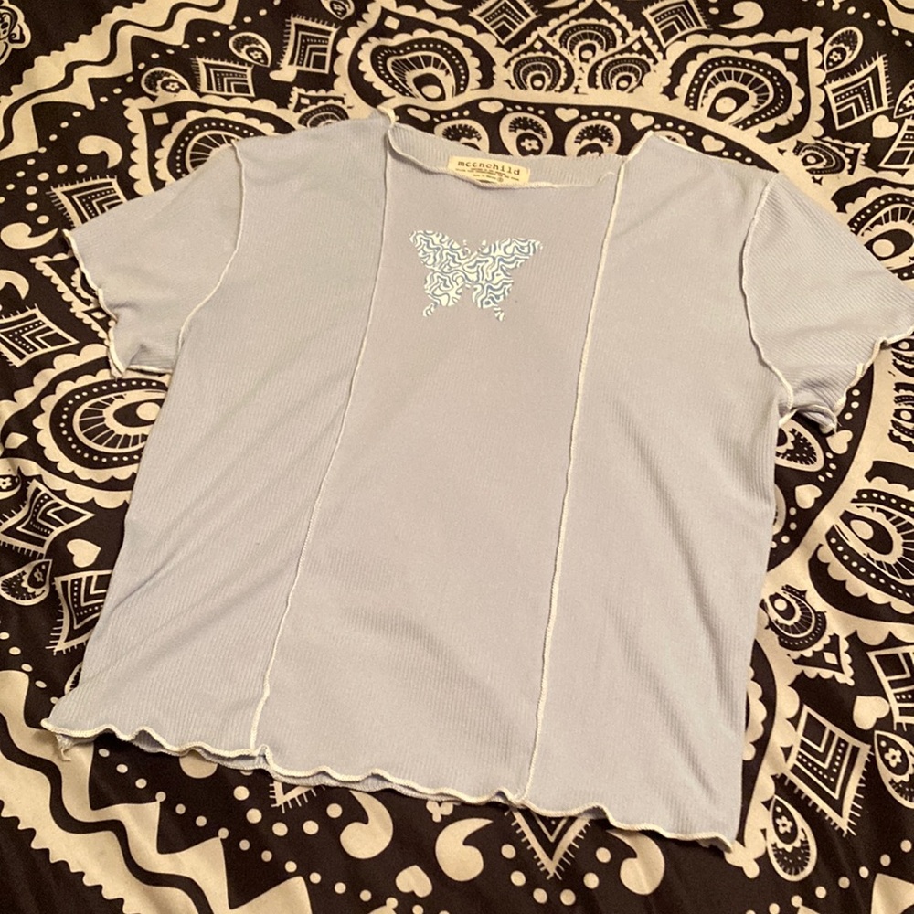 A blue graphic t shirt. Size s.